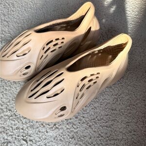 Adidas Yeezy Foam Runner shoes in a tan